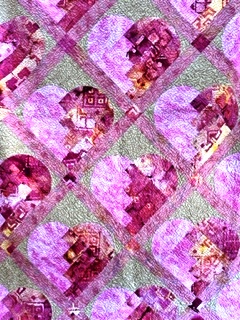 beautiful quilt of pink hearts